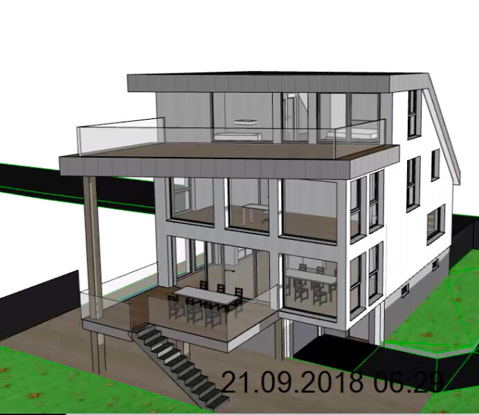 Modern multi-story house with glass facade, balcony, terrace and external stairs.