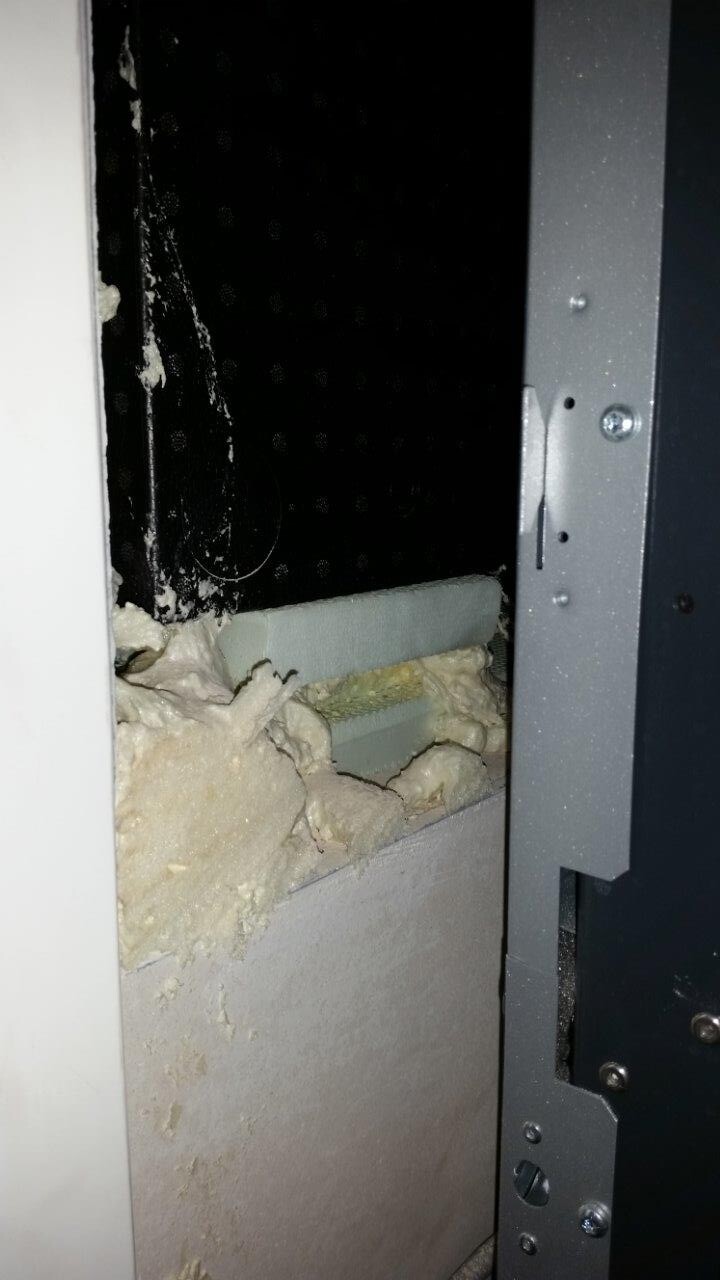 Door frame with insulation in open wall opening – construction site