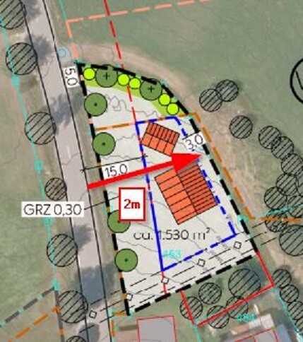 Site plan of a building plot with building footprint, trees, and dimension lines