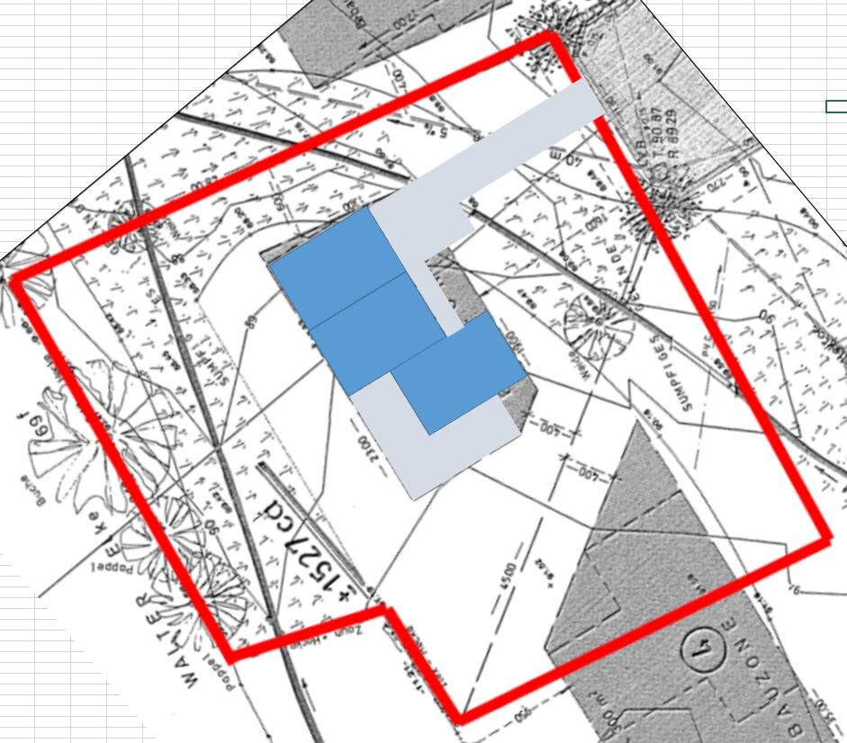 Technical drawing of a building plot with a red boundary line and blue buildings in the center.