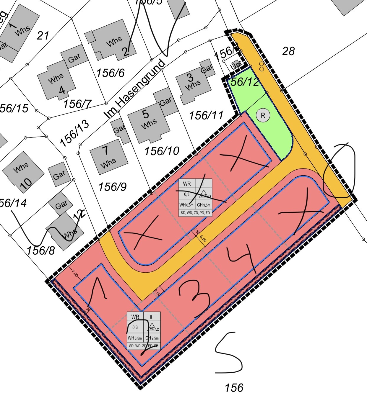 Development plan of a plot with color-coded zones, road layout, and buildings.