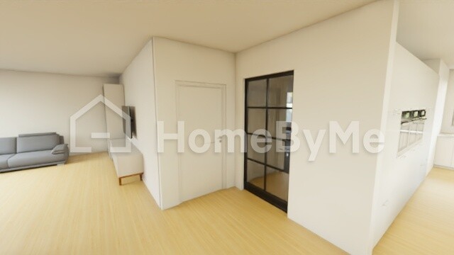 Bright living hallway with wooden floor, glass door with black frame, sofa in the background.