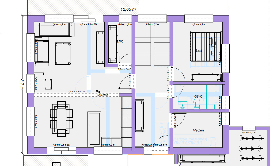 Floor plan of a house with stairs, living/dining area, guest room, bathroom, and media room.