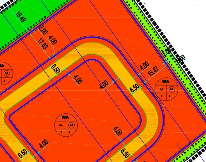 Site plan of a building plot with color-marked areas and access roads