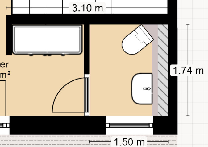 Floor plan of a bathroom with bathtub, toilet, and washbasin