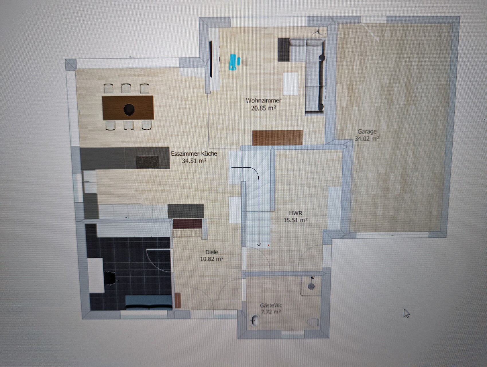 Floor plan of a detached house: living room, dining/kitchen, hallway, utility room, guest WC, garage