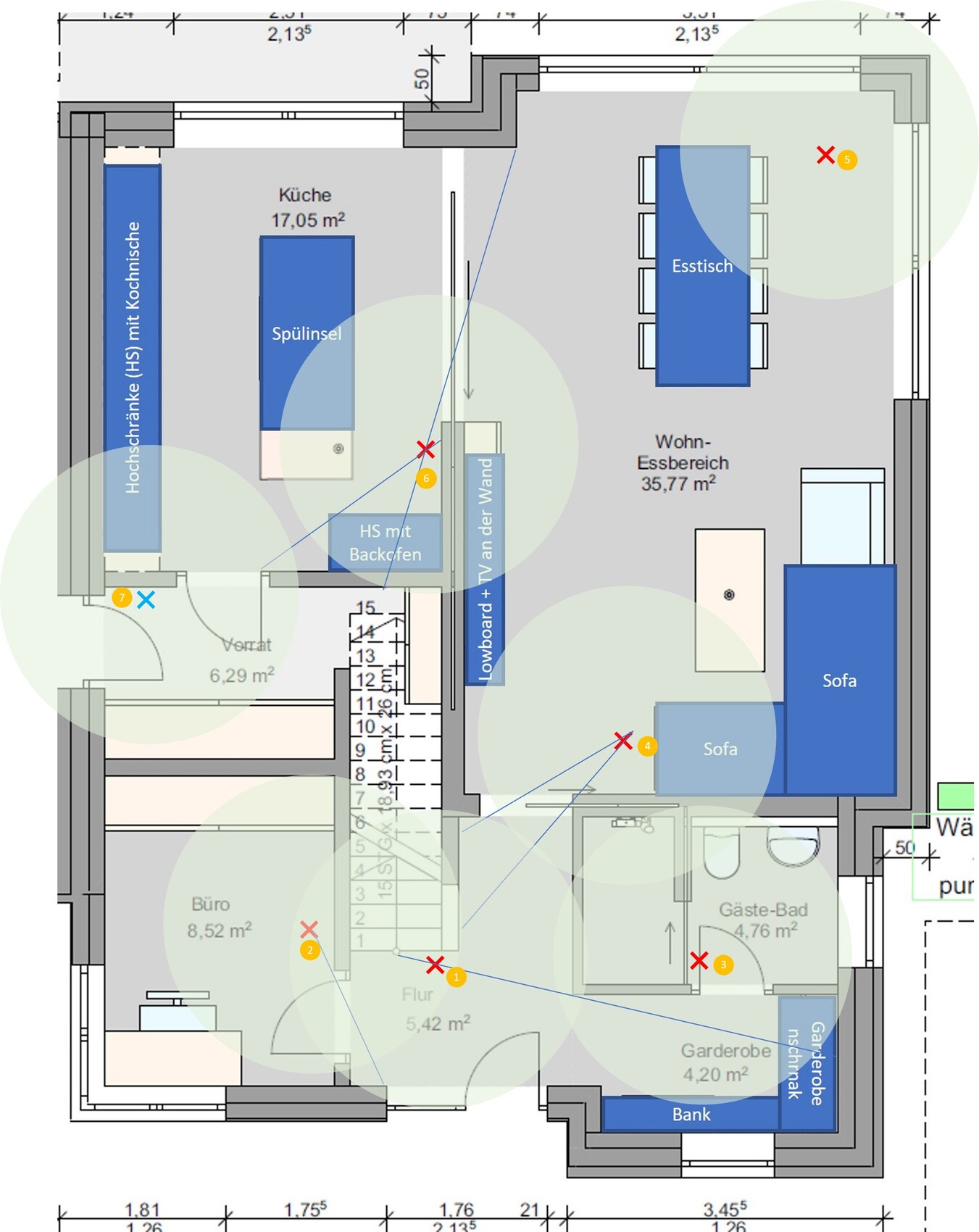 Floor plan of a living space with kitchen, dining table, sofa, and cloakroom