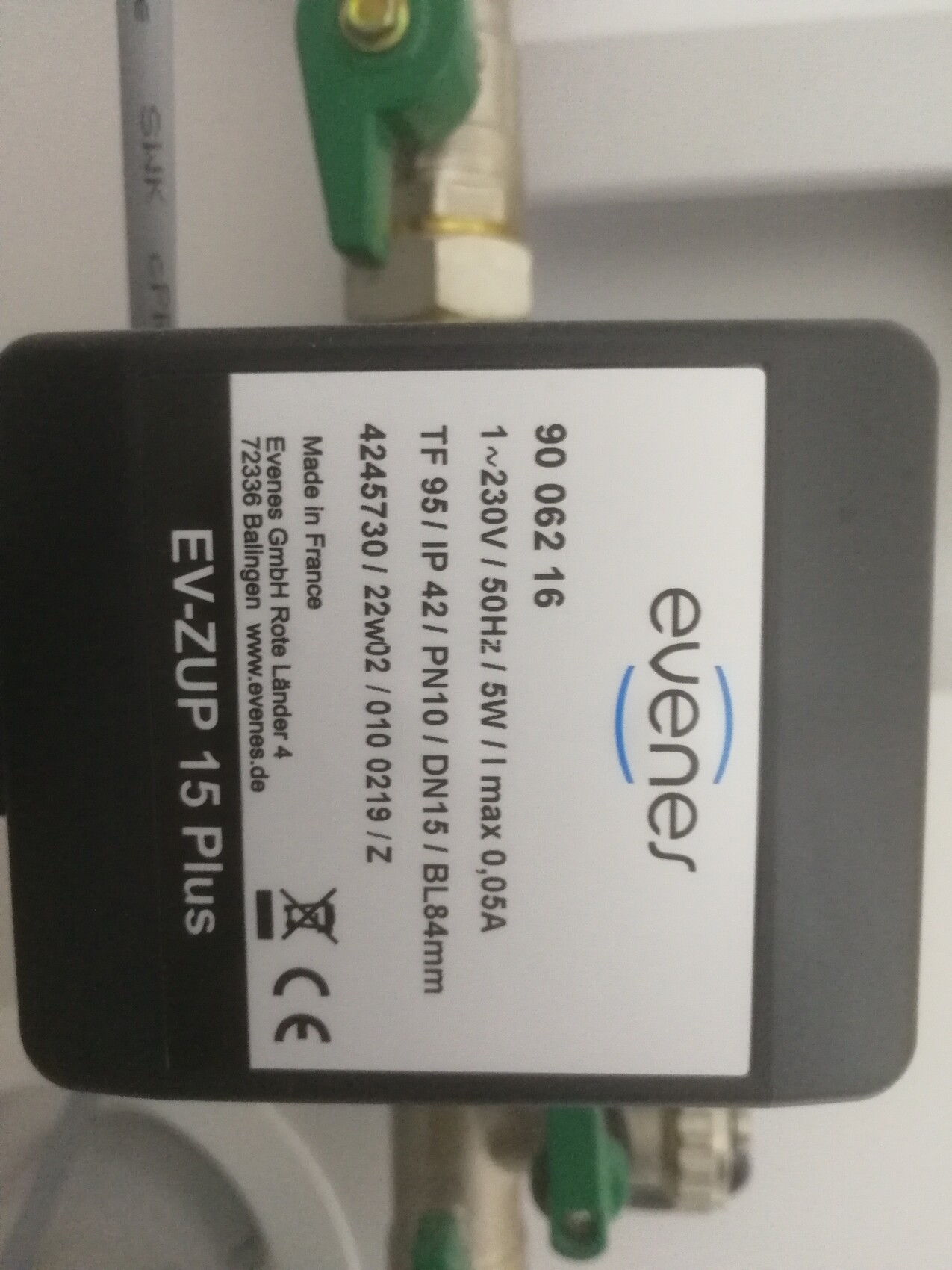 Black EV-ZUP 15 Plus control unit with white label; green valves behind.