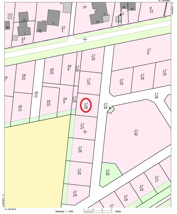 Site plan with numbered plots; red circle marks parcel 17/28 at a street.