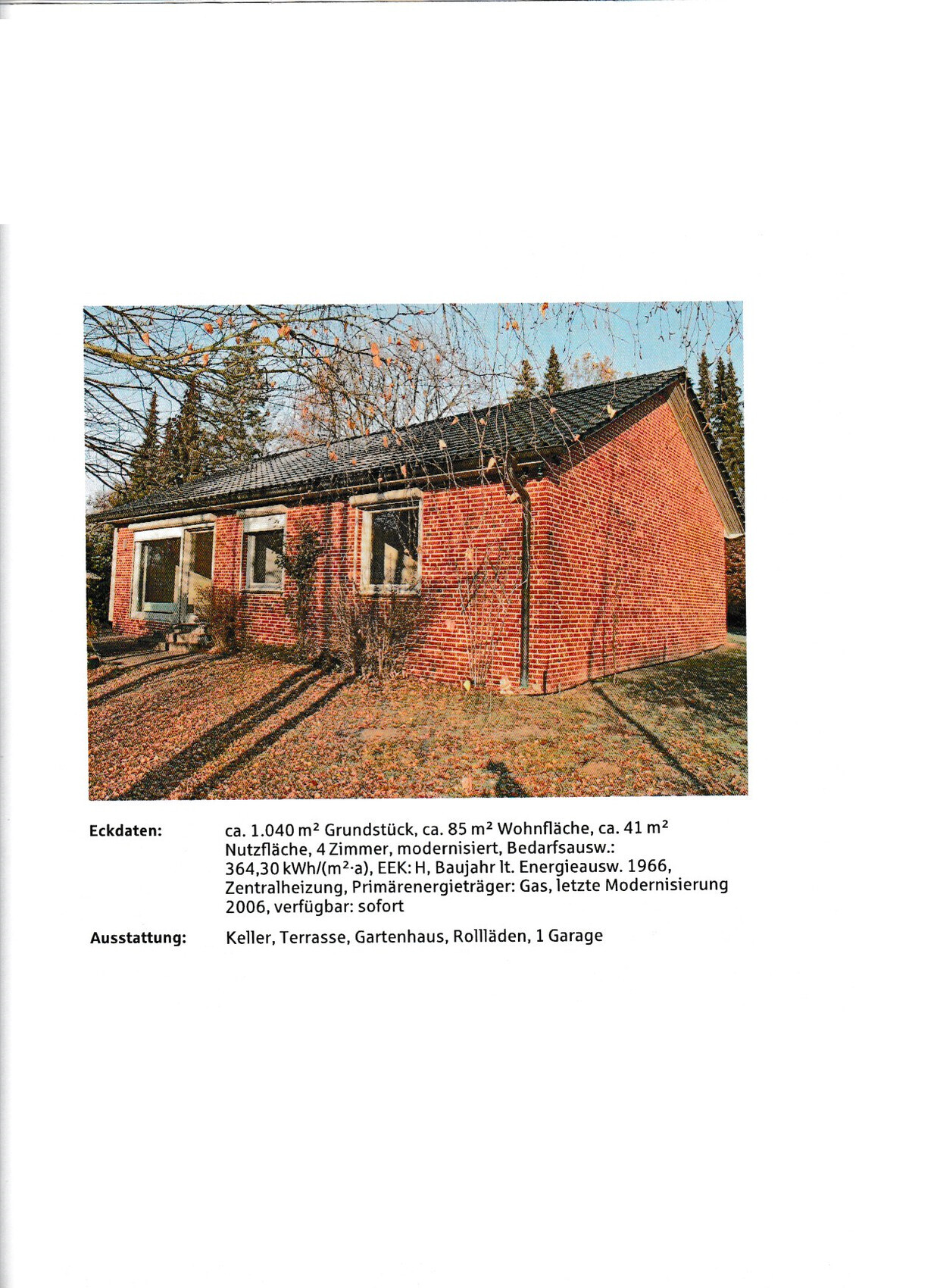 Exterior view of a red brick house with garden in autumn