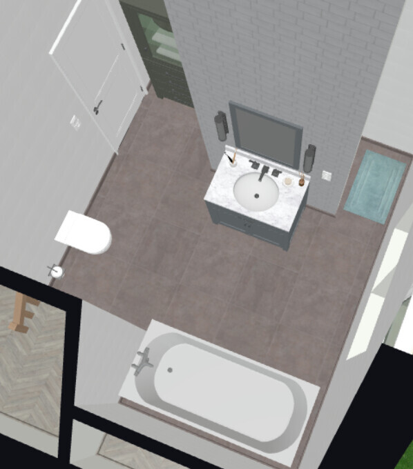 Bird’s-eye view of a bathroom with sink, mirror, bathtub and toilet.