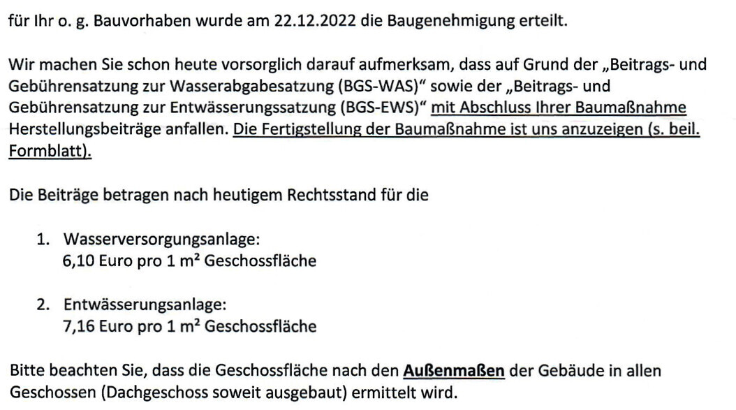 Official document: Building permit/planning permission dated 12/22/2022; notes on water and drainage contributions.