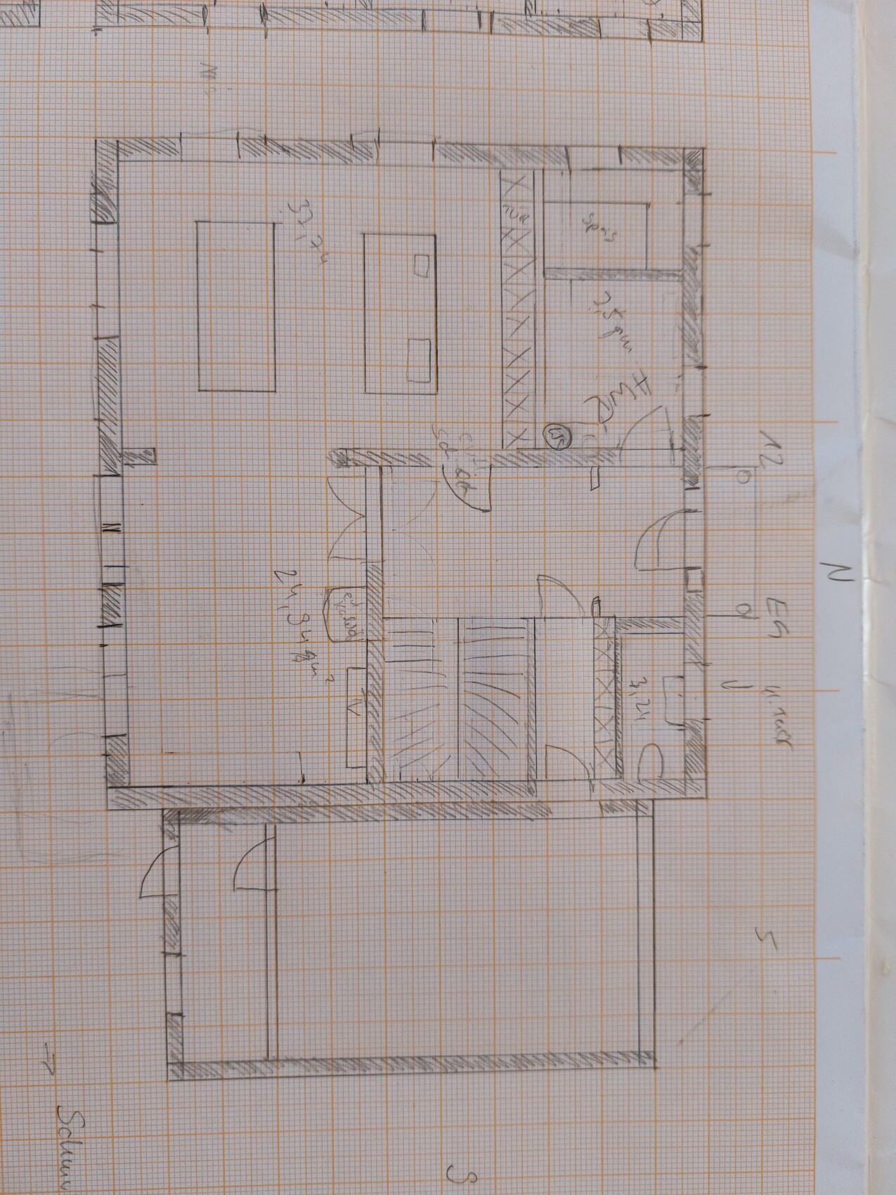Hand-drawn floor plan sketch of a house with interior rooms on graph paper