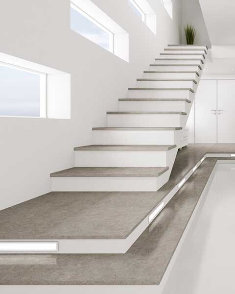 Modern white staircase with floating steps, side windows, and minimalist interior