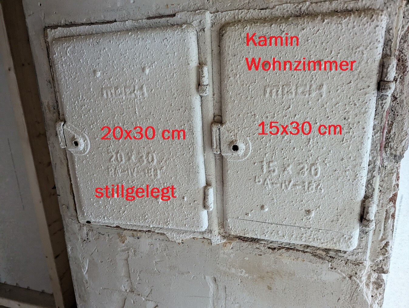 Two old stove doors; left 20x30 cm, decommissioned; right 15x30 cm, living room stove chimney.