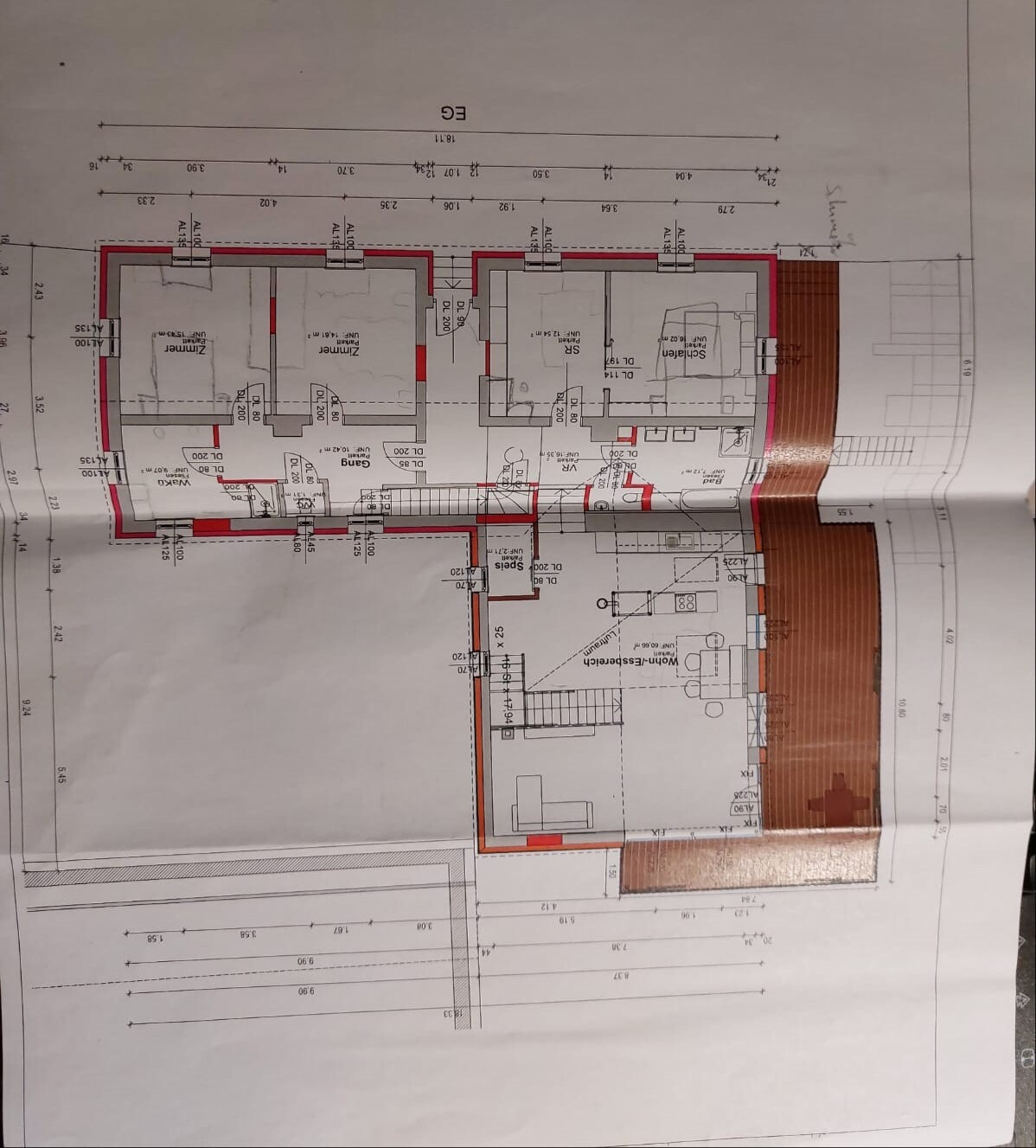 Ground floor plan of a house showing rooms such as living room, kitchen, bedroom; red exterior outline.