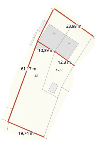 Site plan of a plot with boundary lines, building areas, and measurements