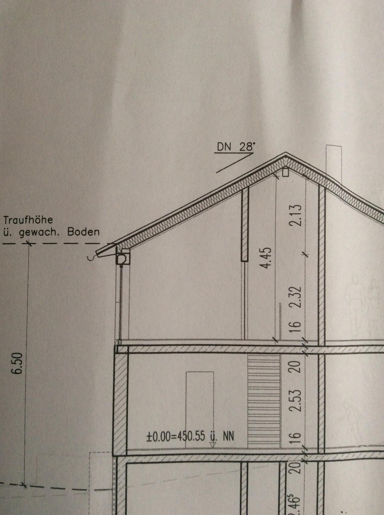 Cross-section of a house with roof, interior walls, and dimensions.