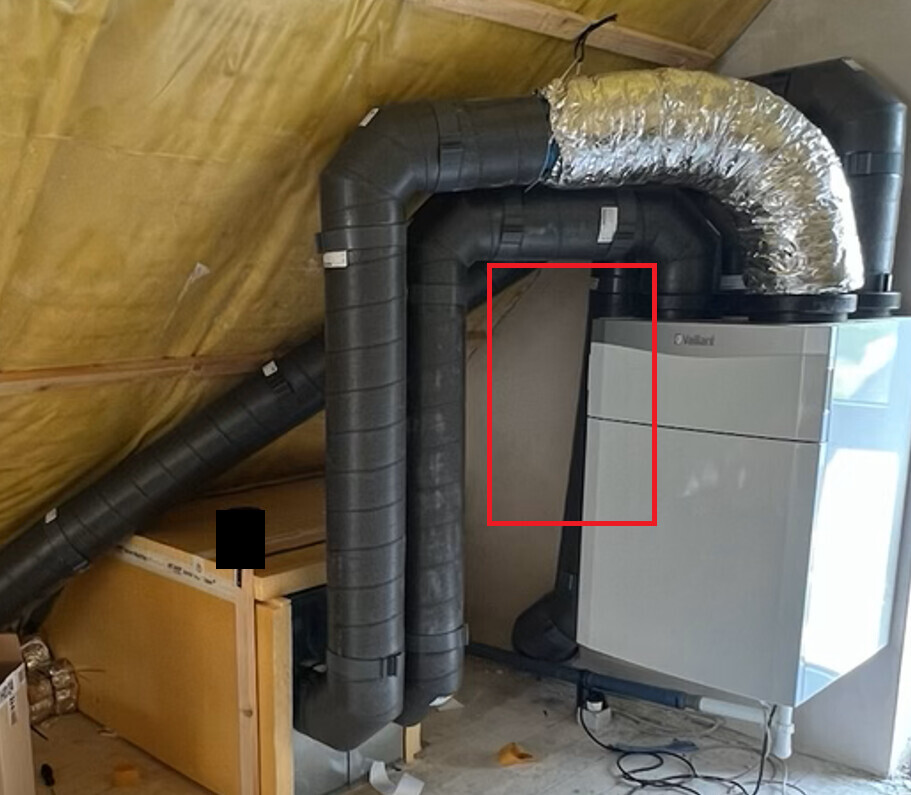 Heating system in the attic: insulated air ducts, silver flexible ducting, and Vaillant boiler.