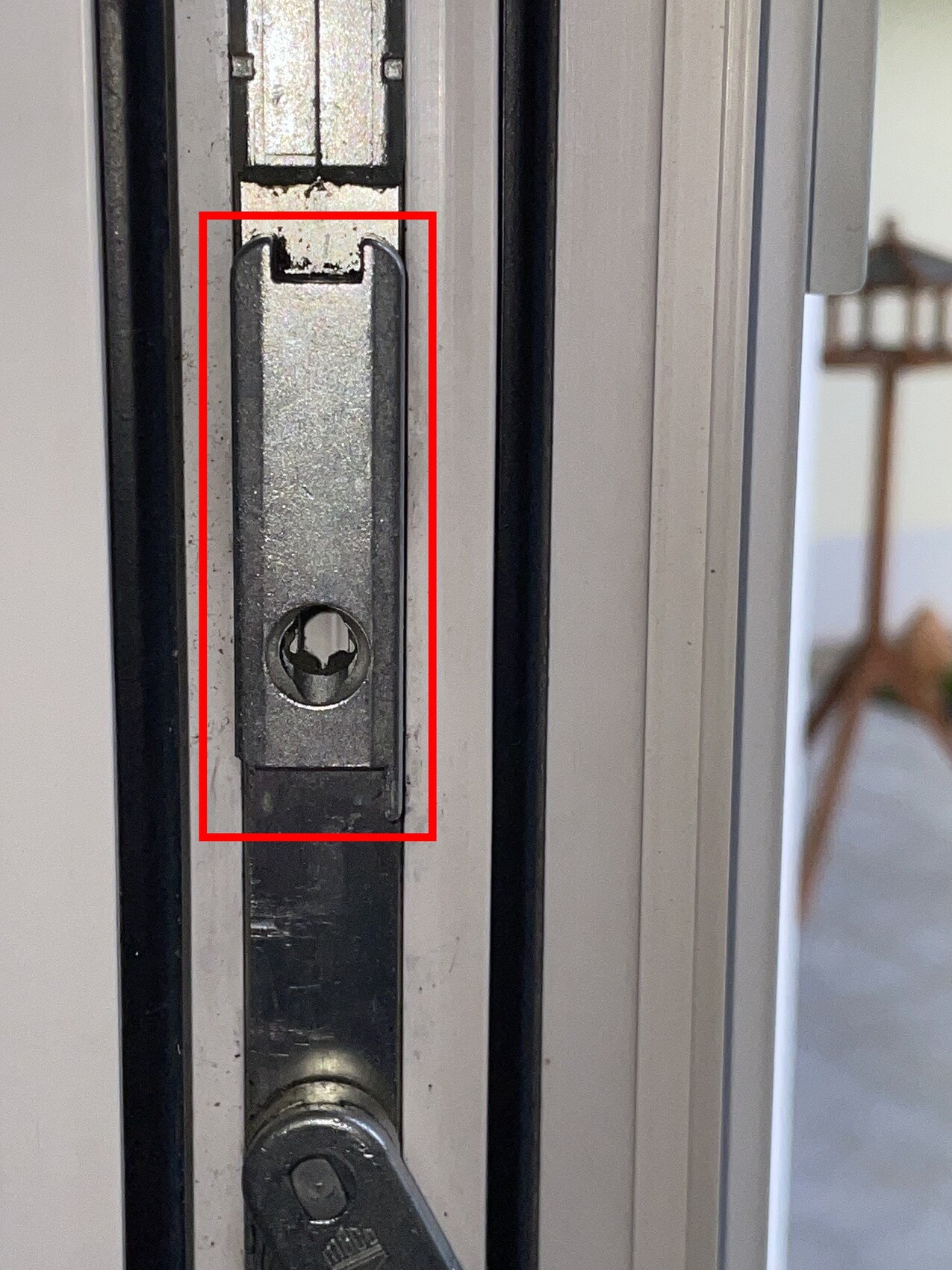 Close-up of a strike plate in the door frame – part of the door lock.
