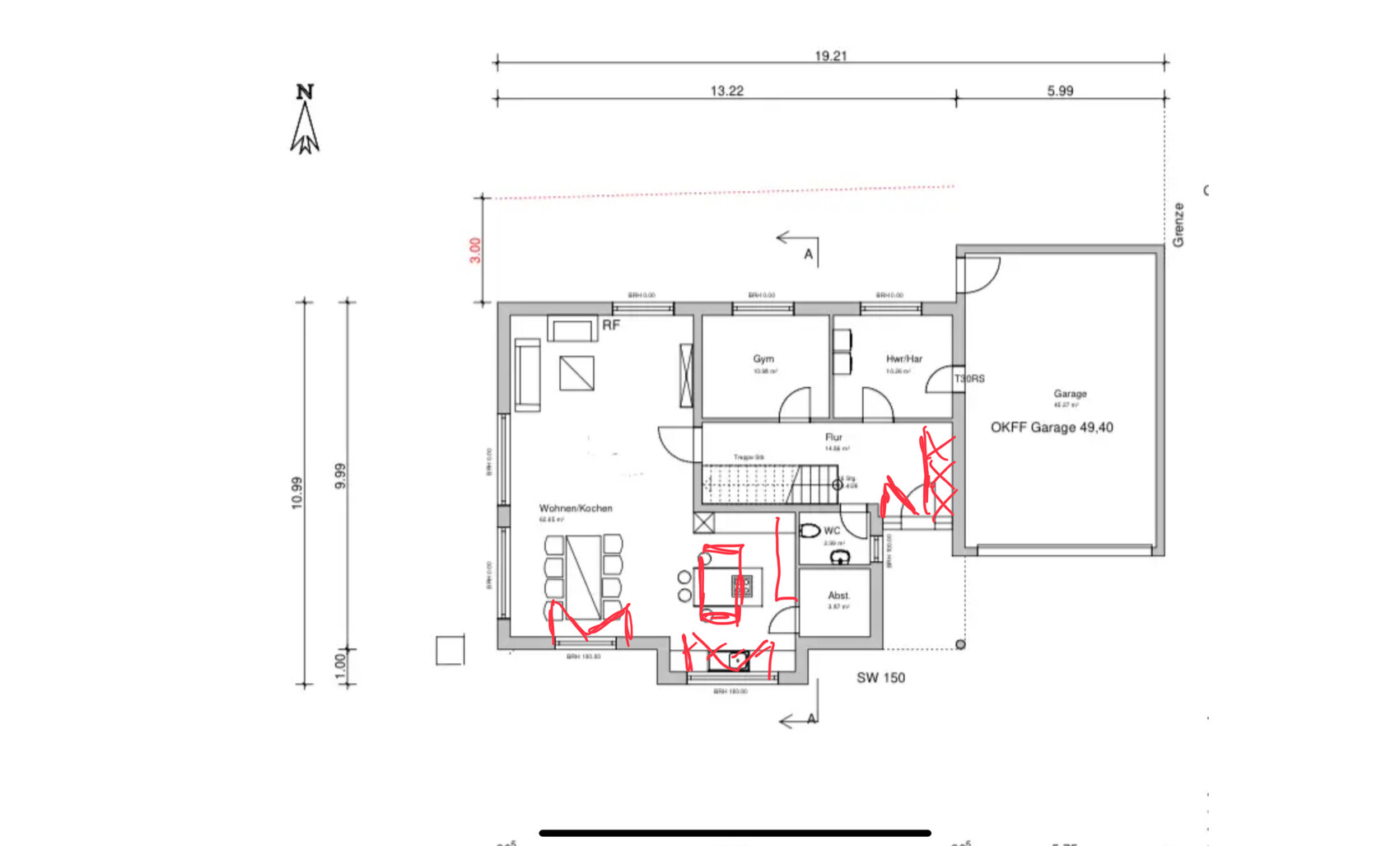 Floor plan of a house with living/kitchen, gym, hallway, toilet, storage room, garage; red markings.
