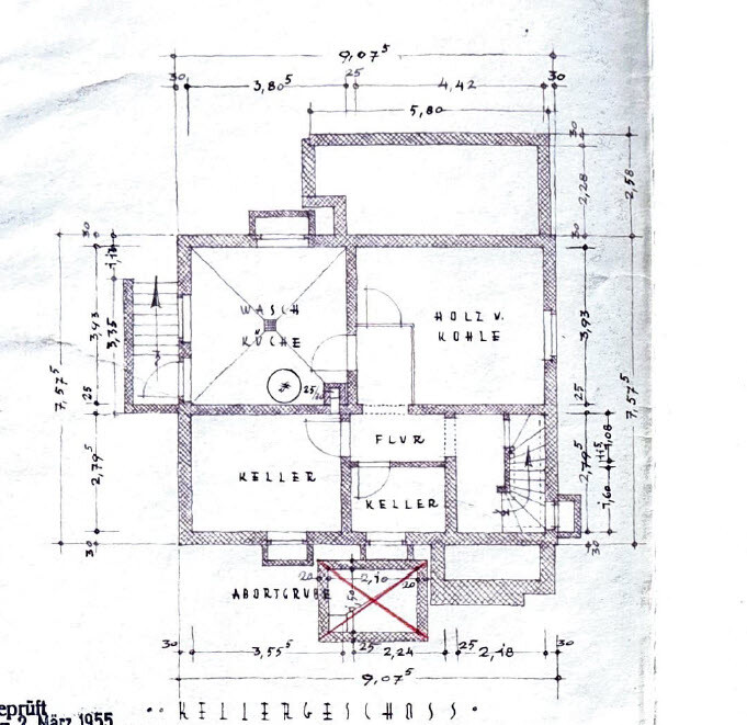 Basement floor plan with hallway, cellar rooms, laundry room, and storage for wood/coal.