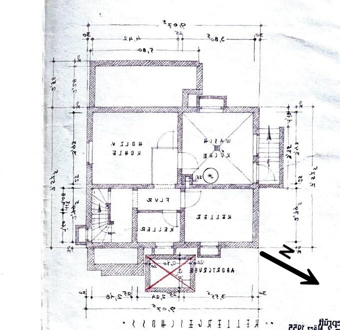 Architectural floor plan of a house with rooms, hallway, staircase, dimension lines, and north direction.