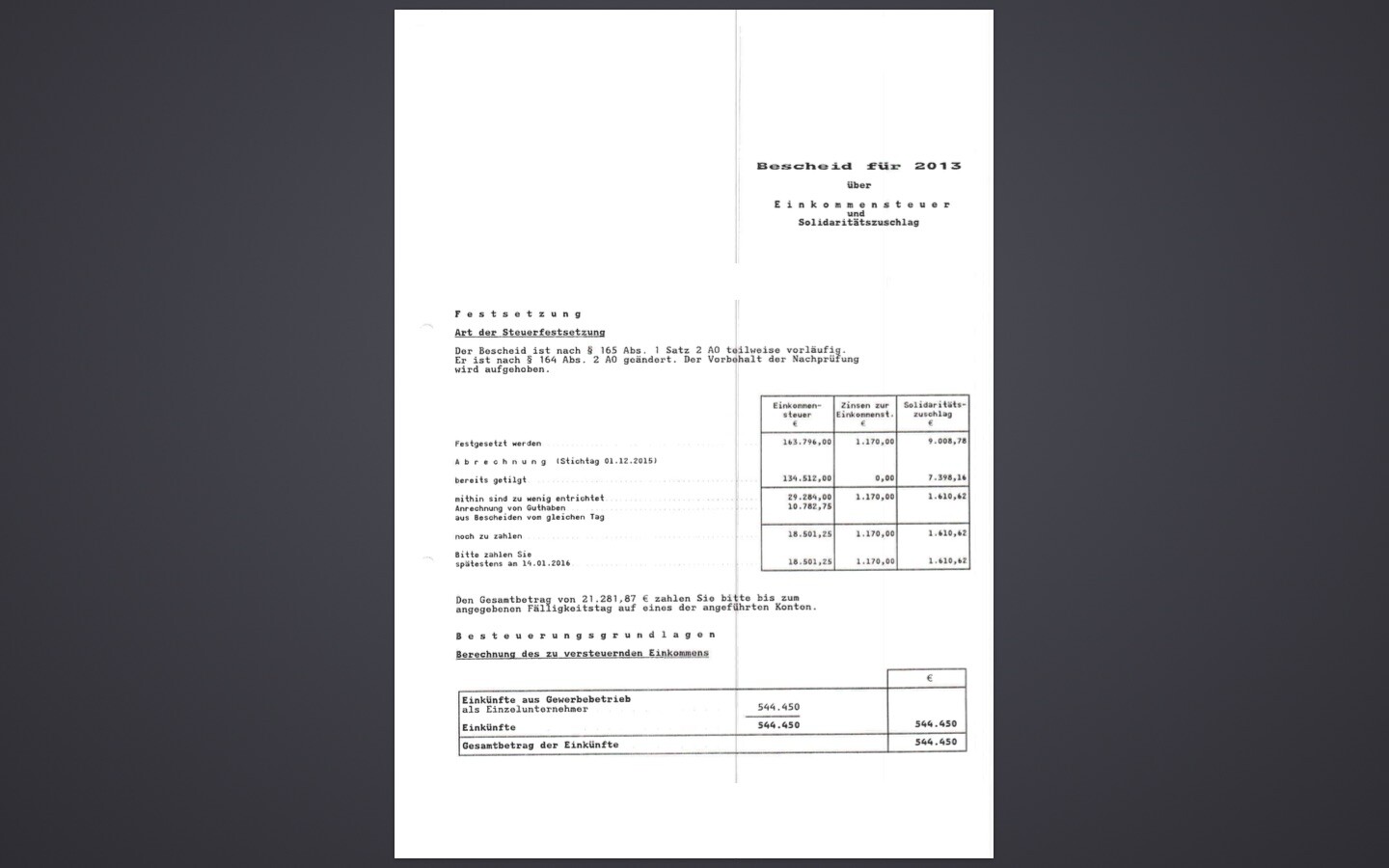 Scan of a tax assessment notice with text and tables for income tax 2013