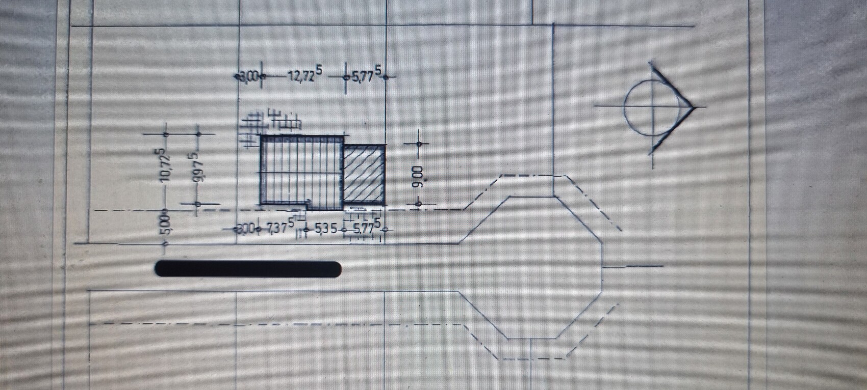 Technical drawing of a long rod with a square block and hexagonal end piece.
