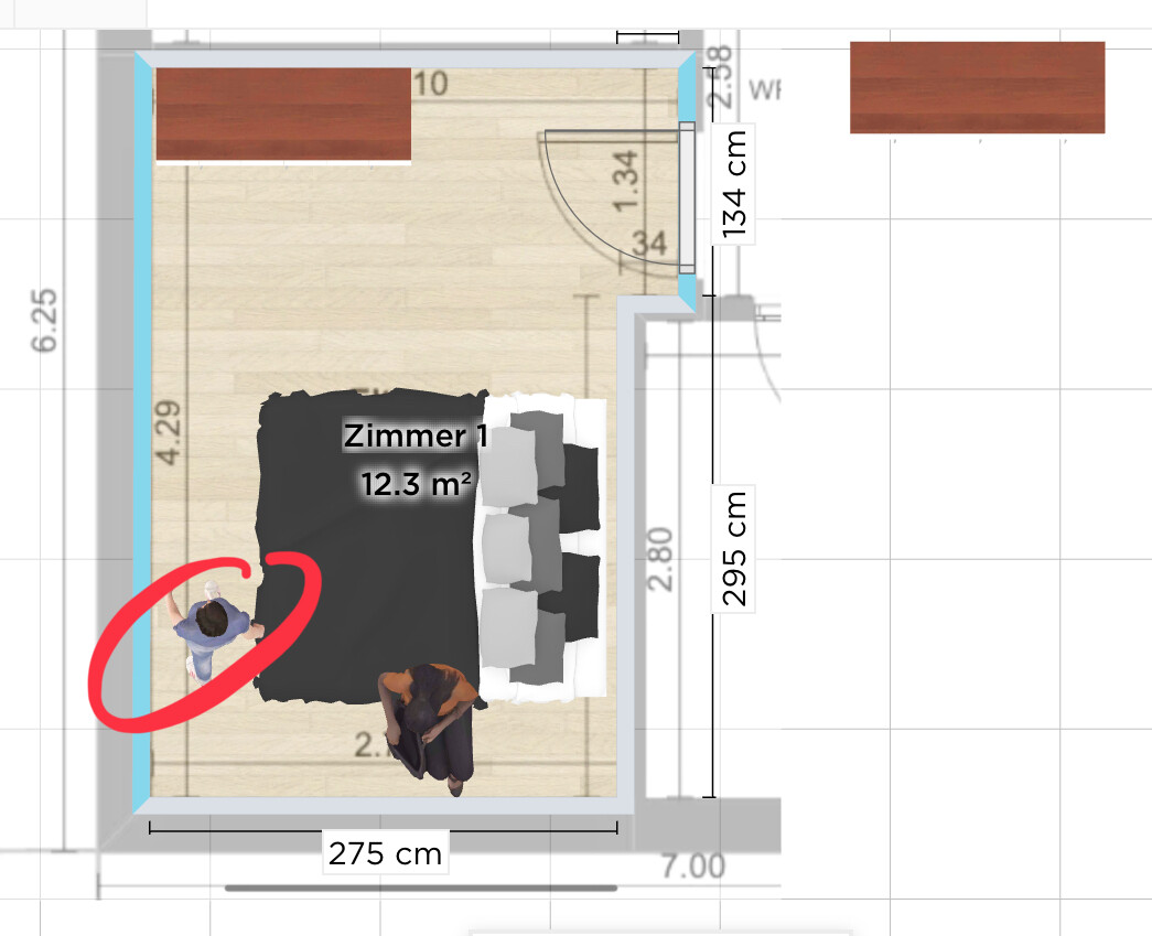 Room 1 floor plan: bed, two people in the room, red marking left of the bed.