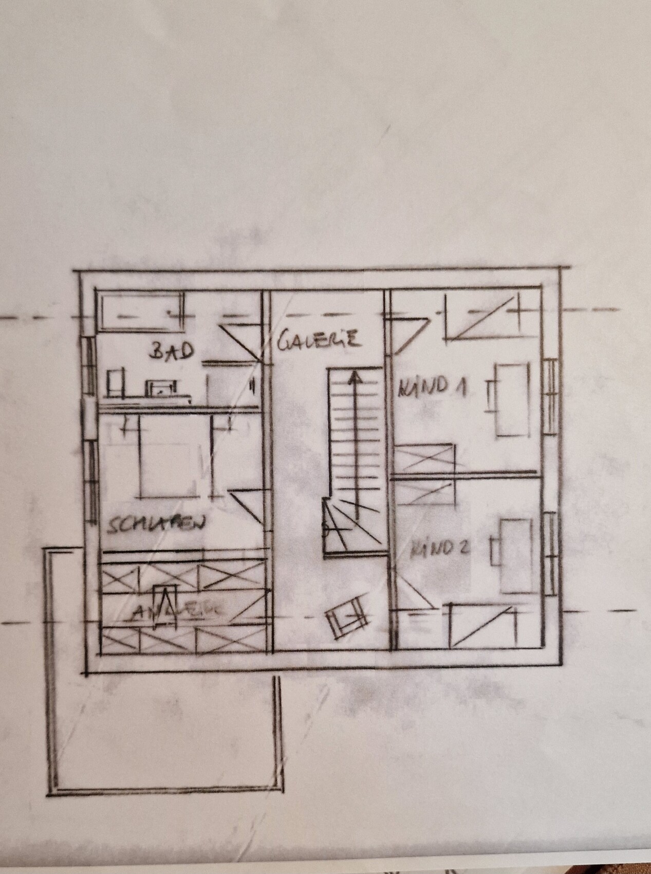 Hand-drawn floor plan: staircase in the middle, bedroom and bathroom on the left, two rooms on the right.