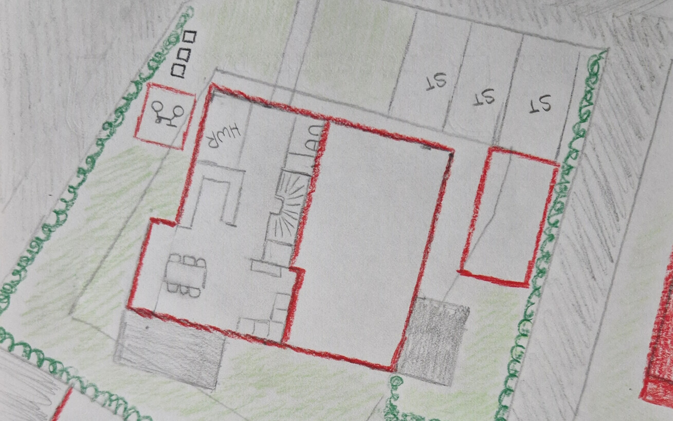 Hand-drawn floor plan sketch of a house with red outline and garden area