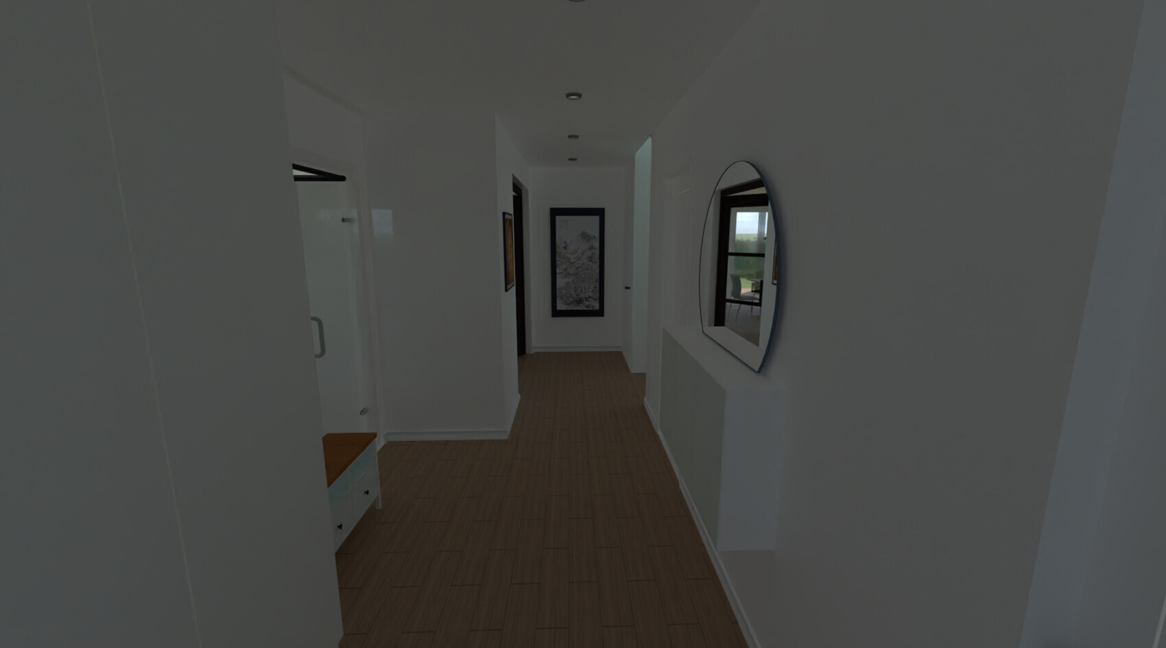 Bright hallway in the house with a round mirror on the wall, wood flooring, and picture frames