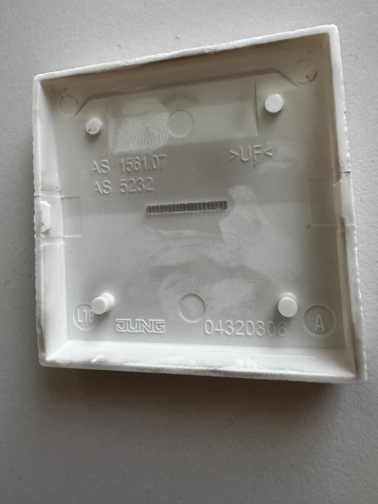 White square flush-mounted wall box backbox with brand logo JUNG