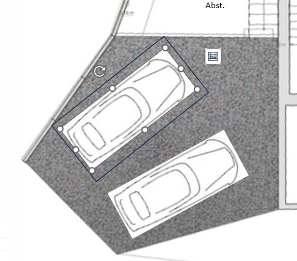 Top view of a garage with two parked cars in floor plan