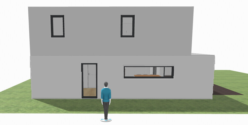 Modern two-story gray facade with door and long window; person standing in the garden.