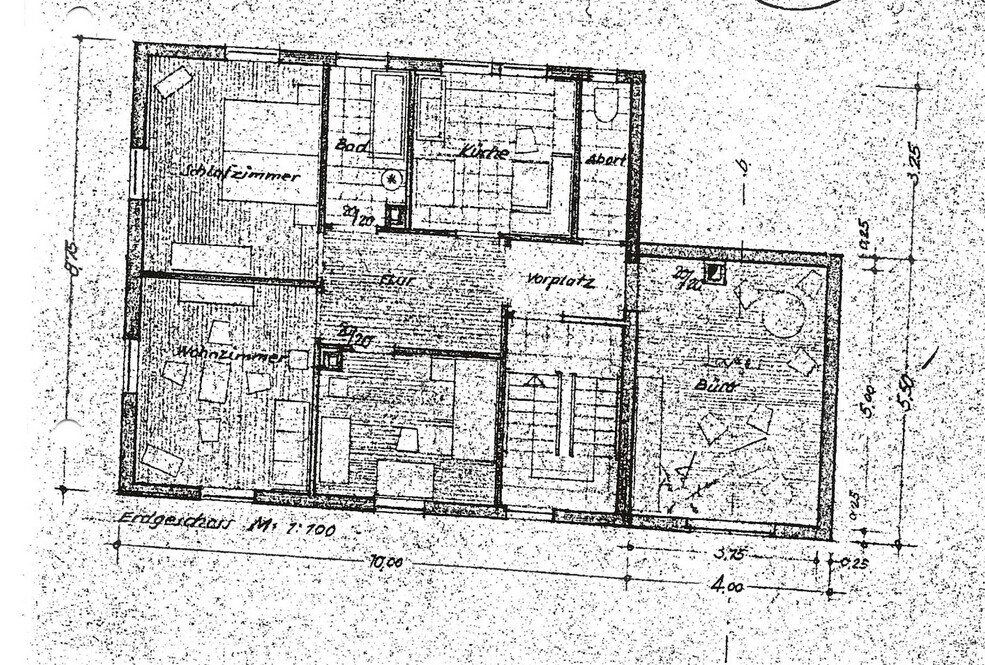 Floor plan of a house with living room, kitchen, bathroom, hallway, and staircase