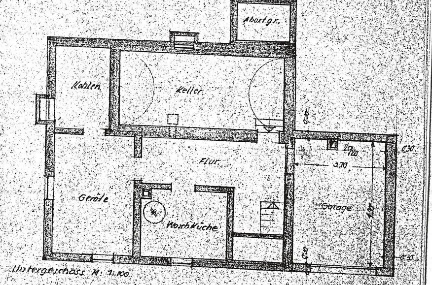 Floor plan of a basement floor with hallway, basement rooms, stairs, and garage