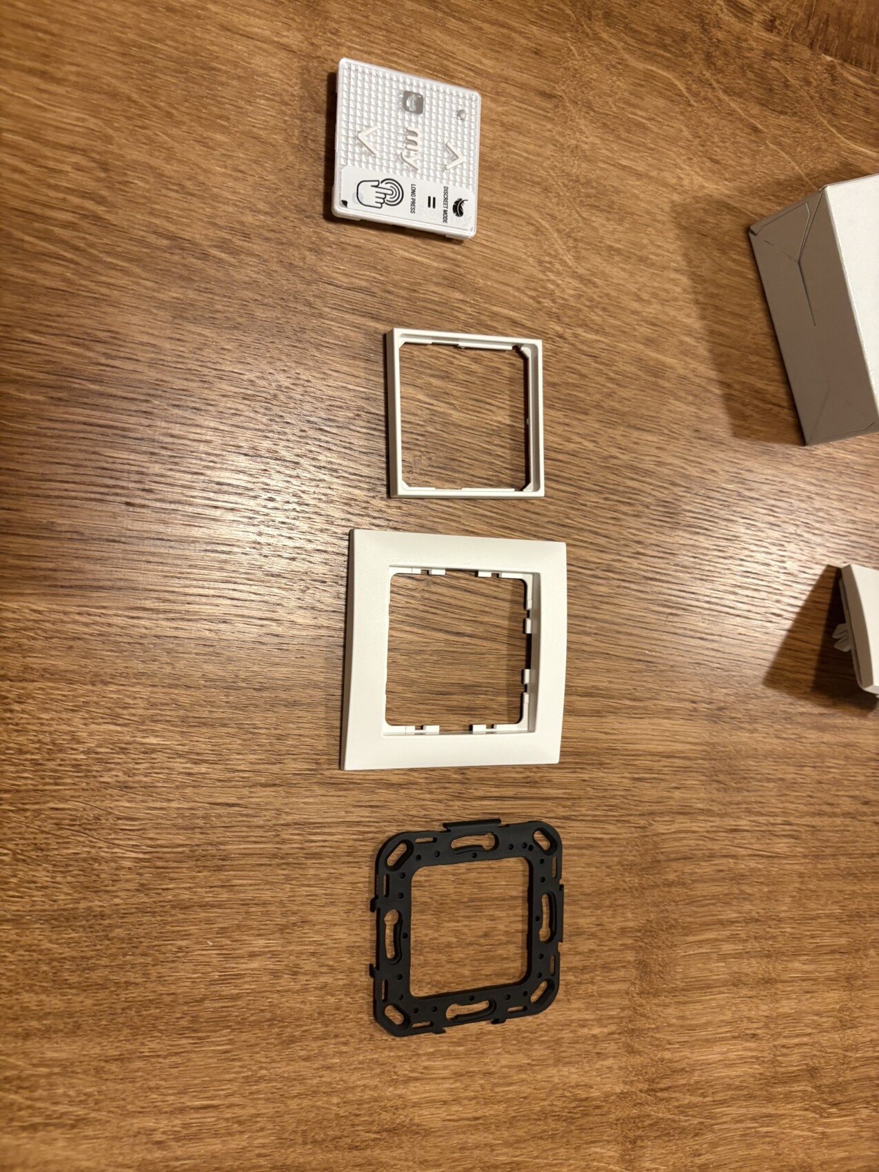 Various switch frames and cover frames made of plastic on wood table