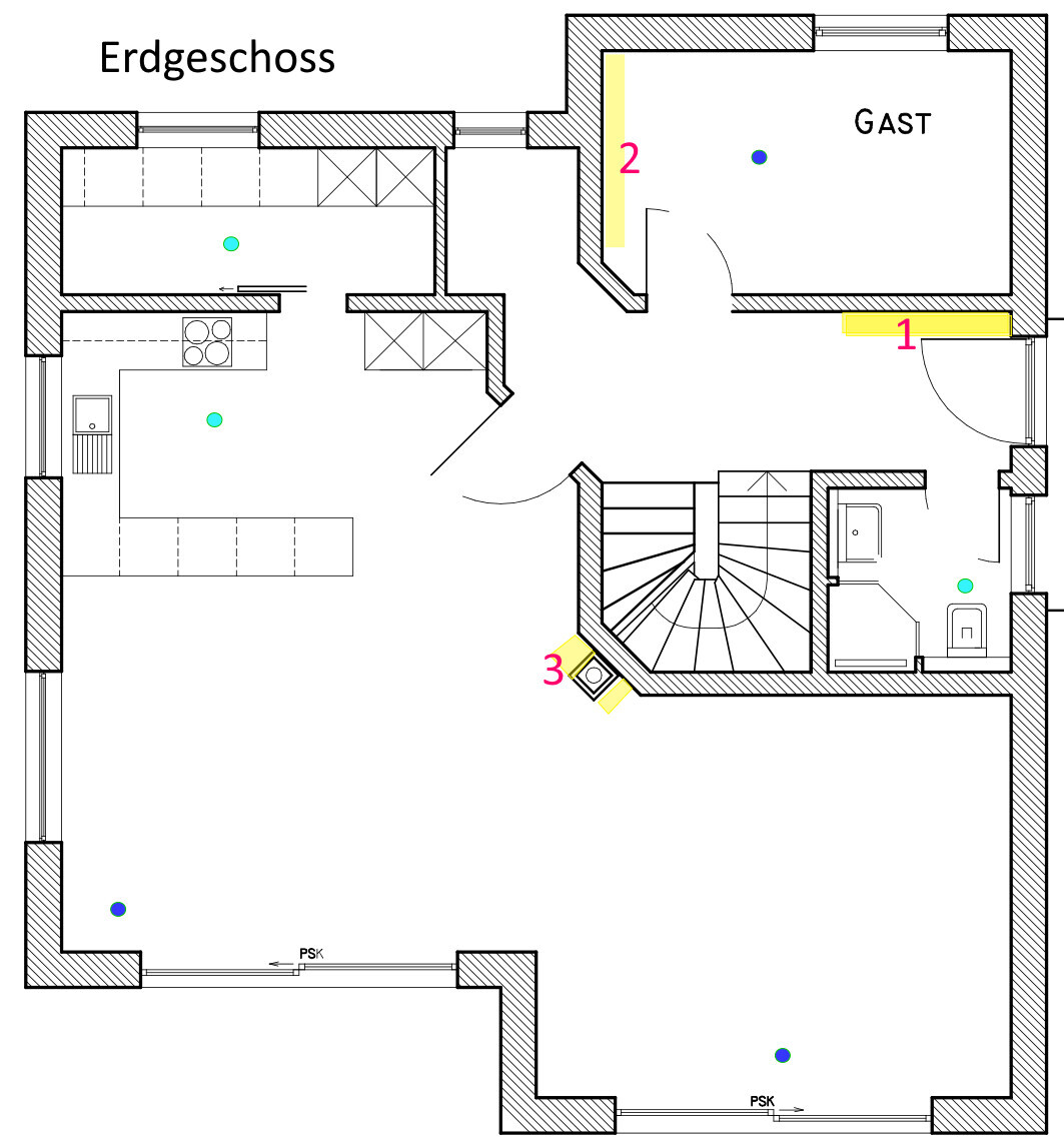 Ground floor plan: Kitchen on the left, guest room on the right, staircase in the middle.