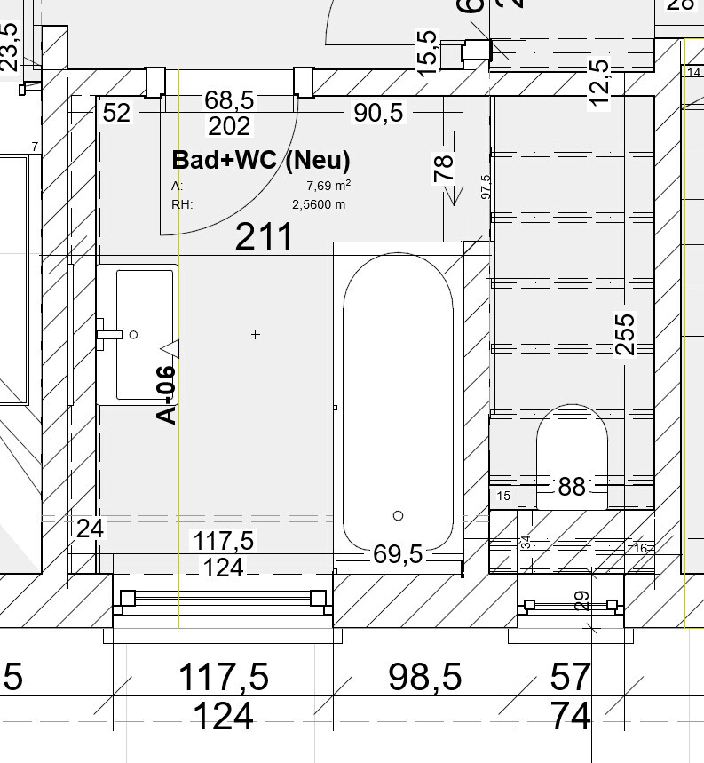 Bathroom floor plan with bathtub, sink, and toilet area in one plan