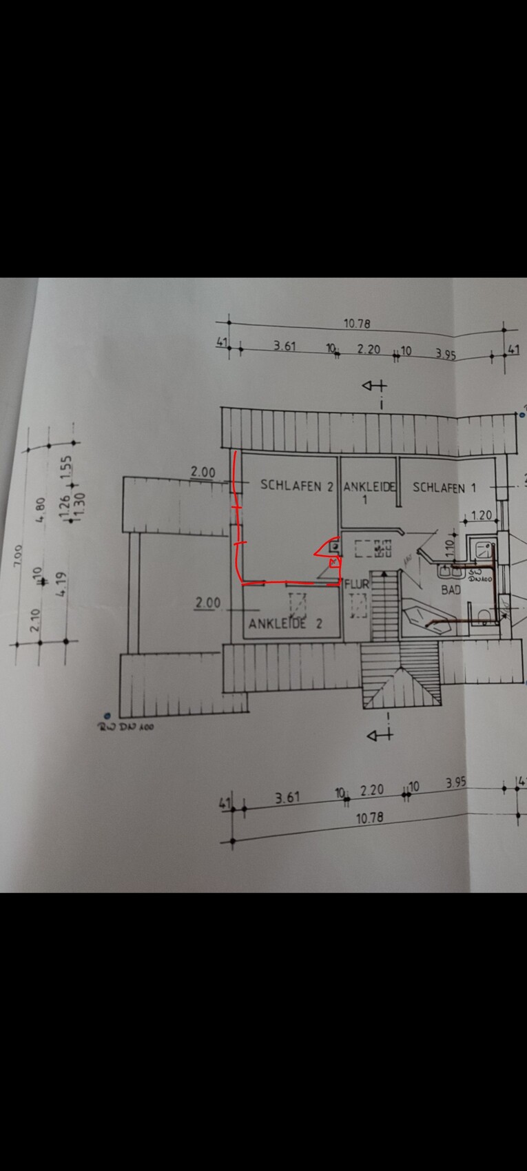 Floor plan of a house with two bedrooms, hallway, walk-in closet and bathroom; red markings