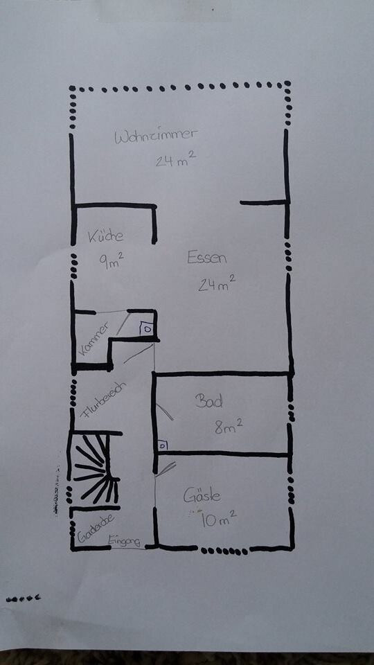 Hand-drawn floor plan sketch of an apartment with living room, kitchen, dining area, bathroom and hallway