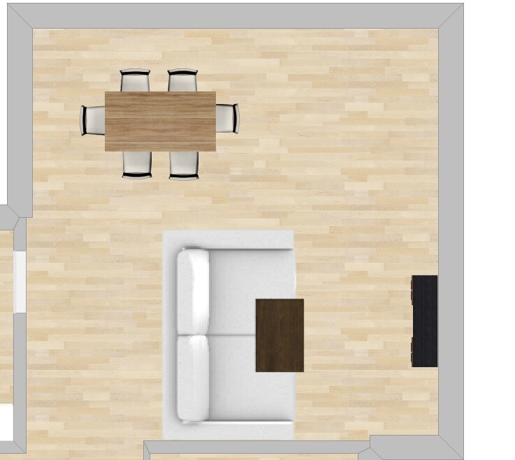 Offenes Wohnzimmer mit Esstisch, Sofa und Couchtisch auf hellem Holzboden