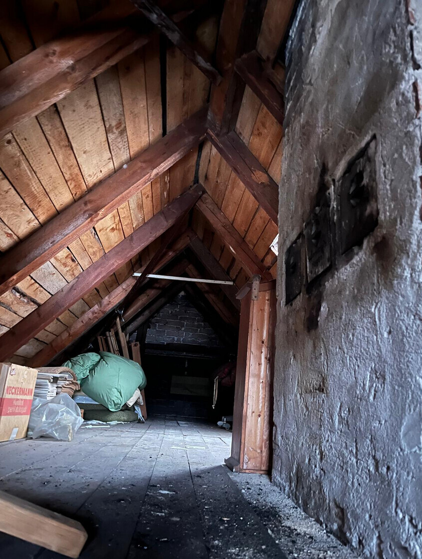 attic-storage-wooden-rafters-boxes.jpg