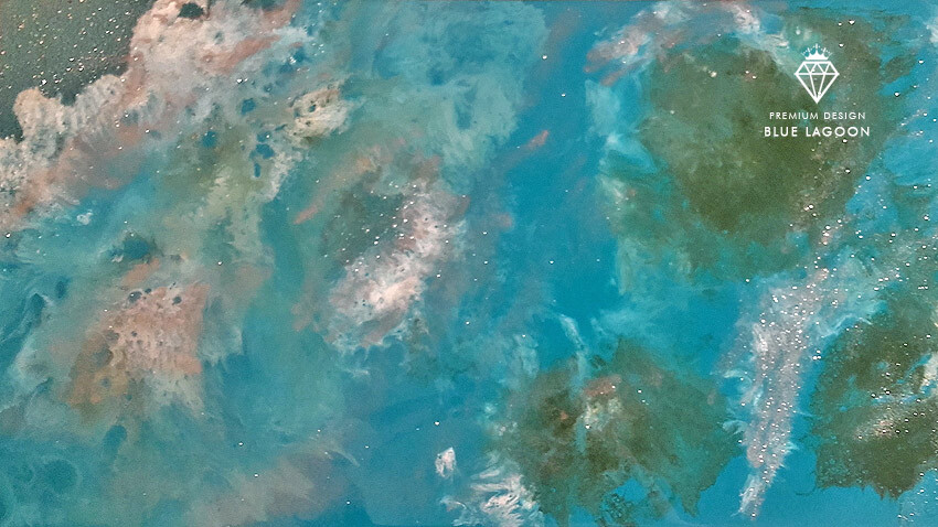 Aerial view of a turquoise lagoon with water surfaces and Blue Lagoon logo